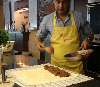 Putting the apple mixture on the phyllo pastry.